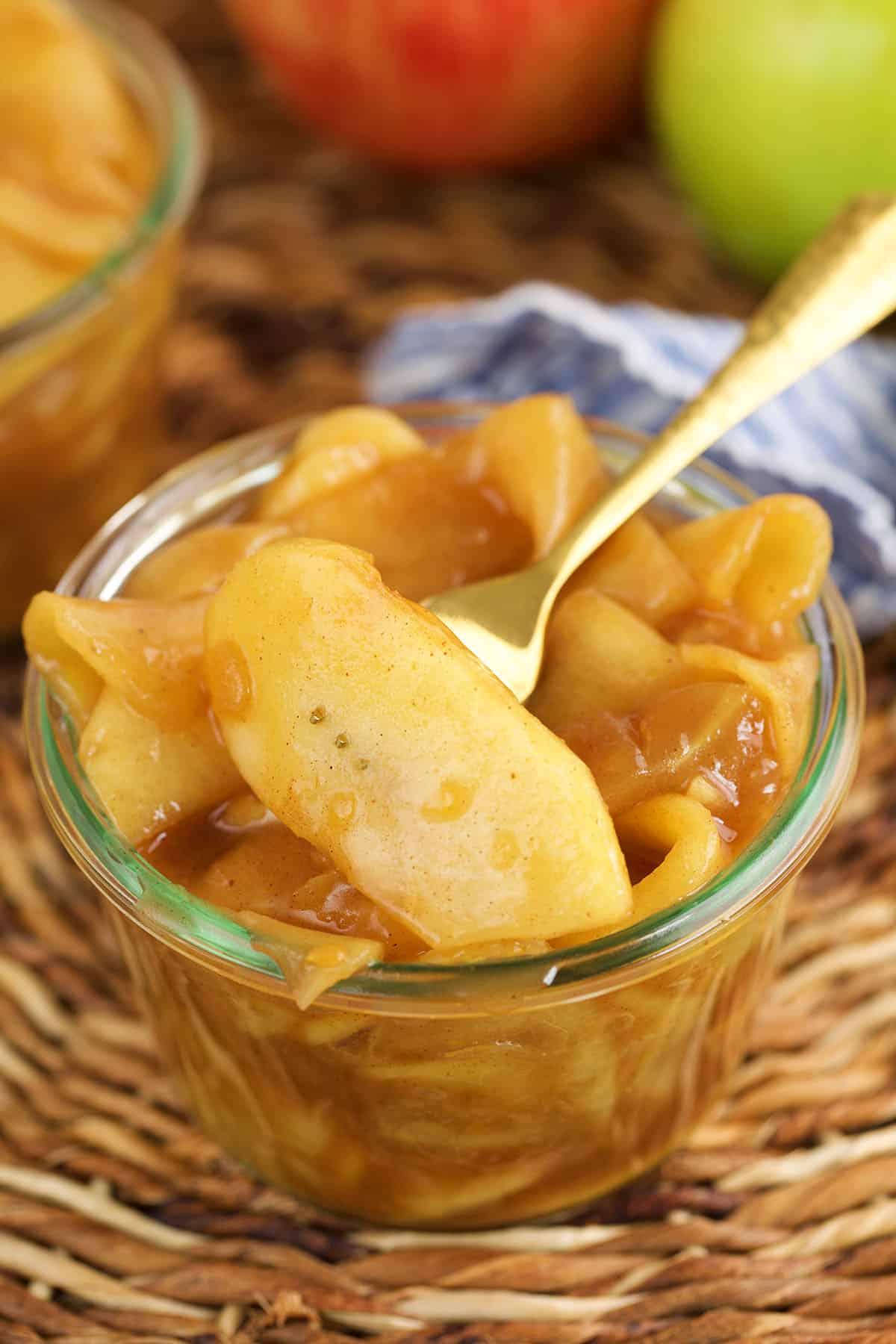 Fork in jar of apple pie filling