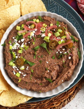 Black bean dip in bowl with tortilla chips