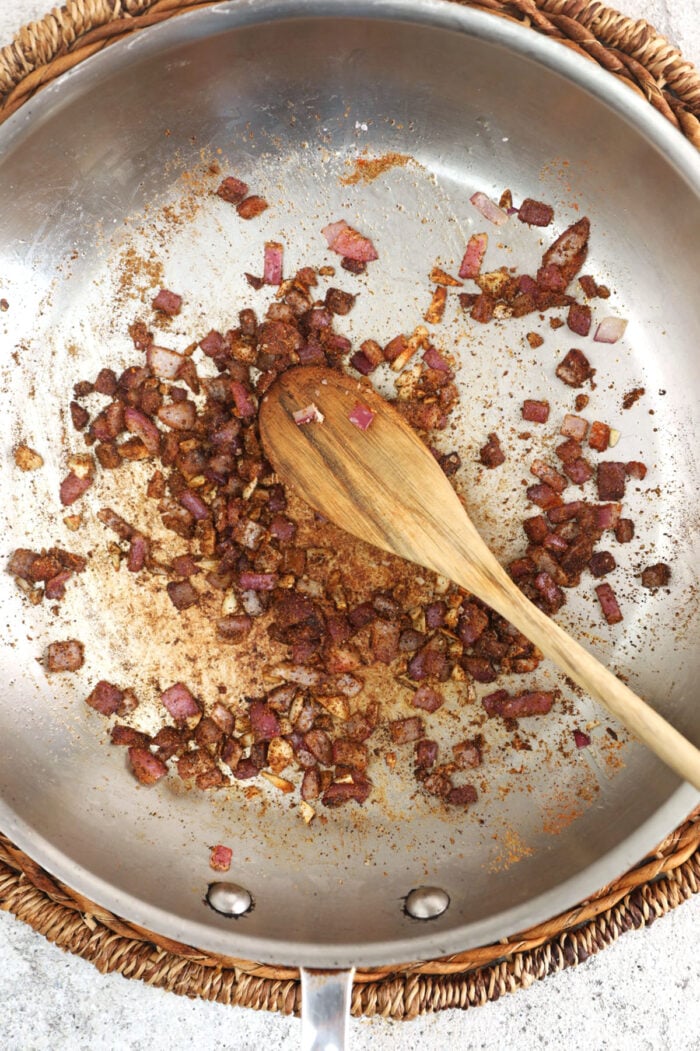 Cooking onion in skillet for bean dip