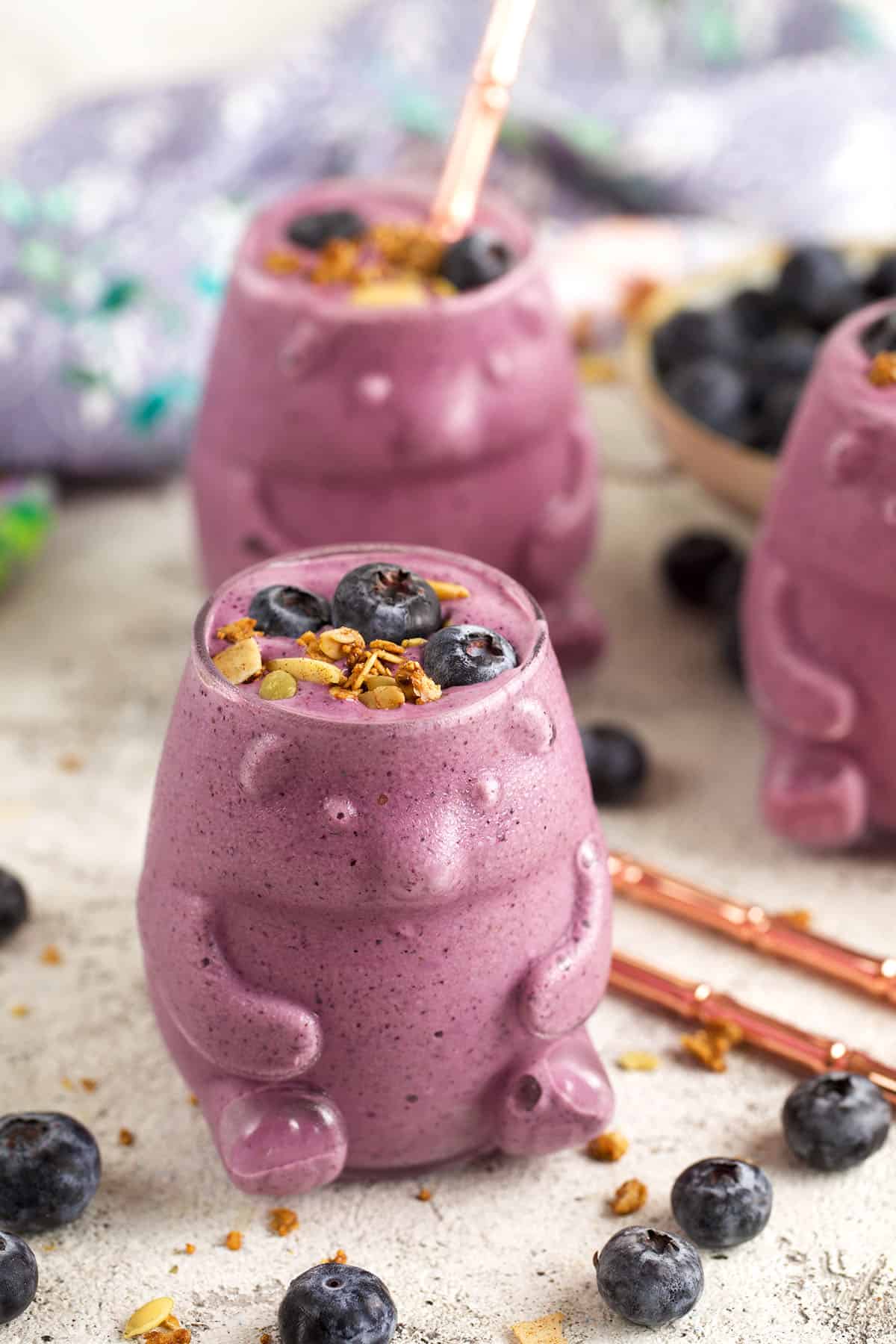 Blueberry smoothie with berries and granola for garnish