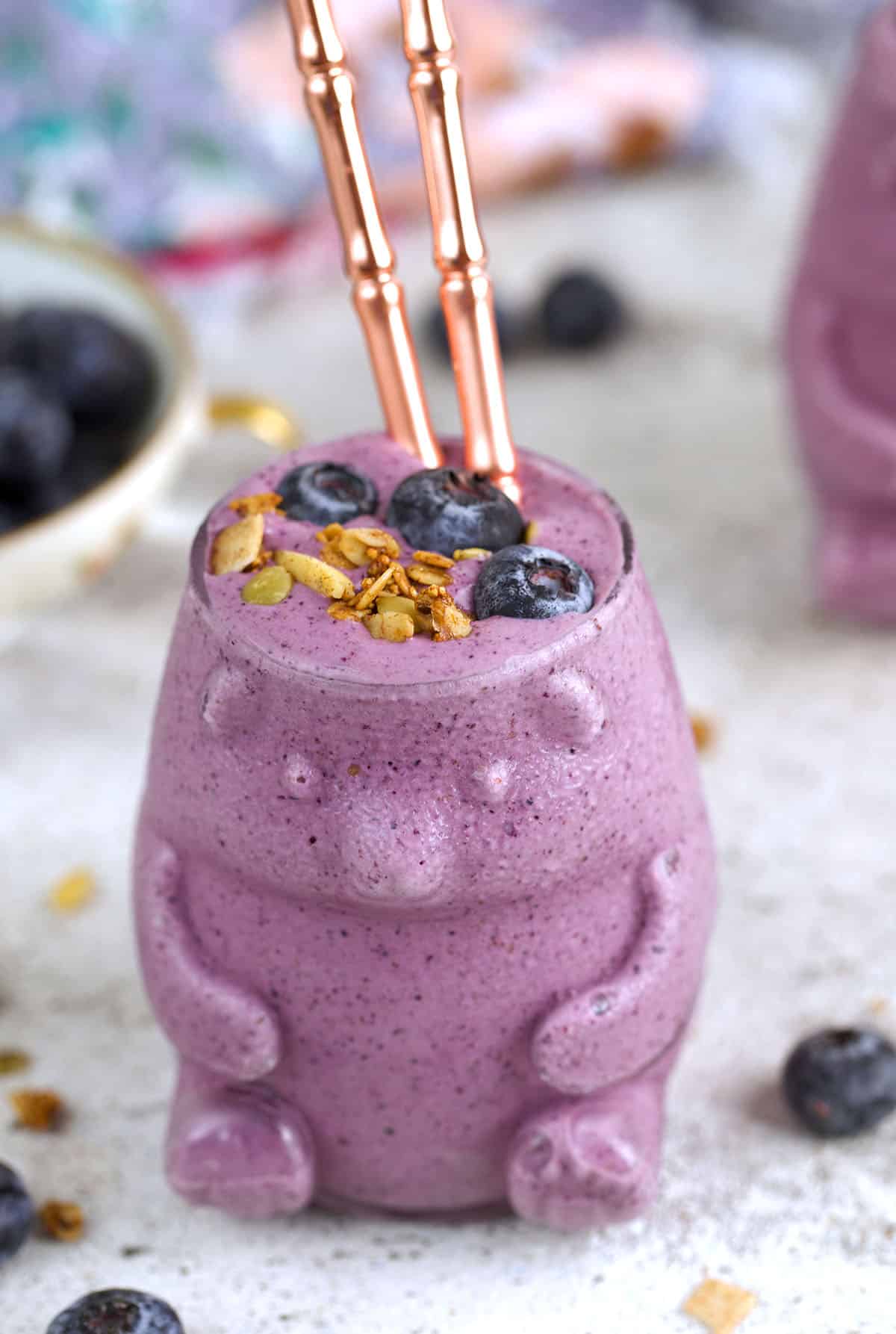 Blueberry smoothie in bear-shaped glass