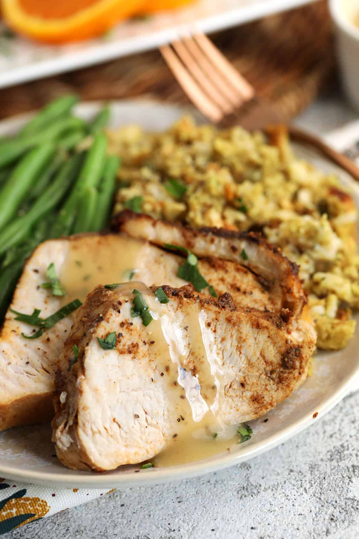 Cajun blackened turkey breast on plate with gravy