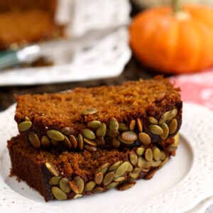 Two pieces of pumpkin loaf on plate