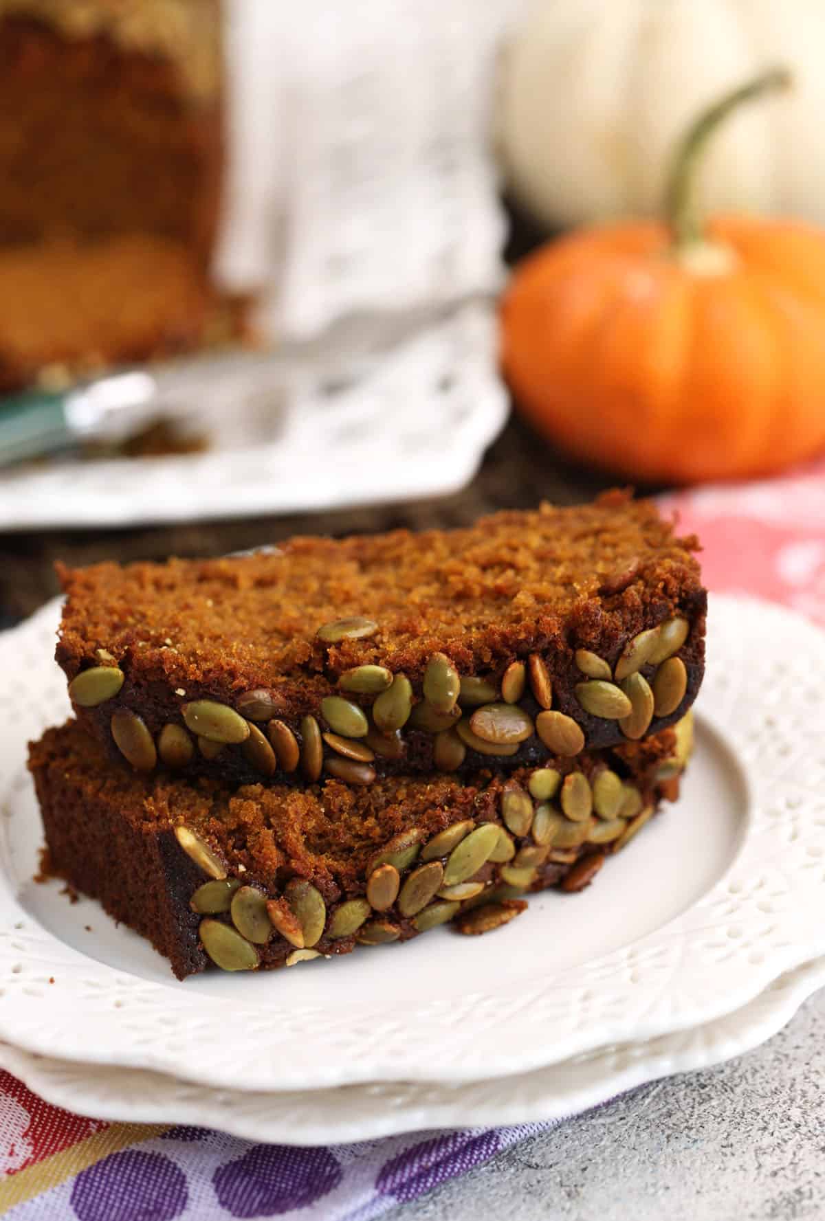 Two pieces of pumpkin loaf on plate