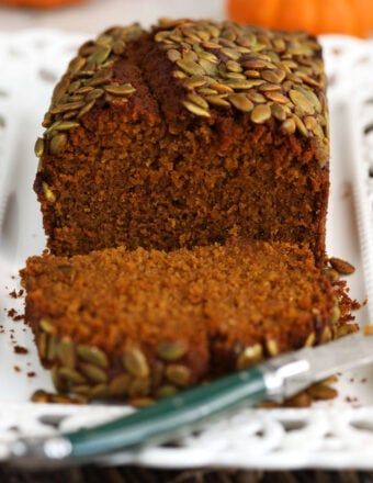 Sliced pumpkin loaf with knife