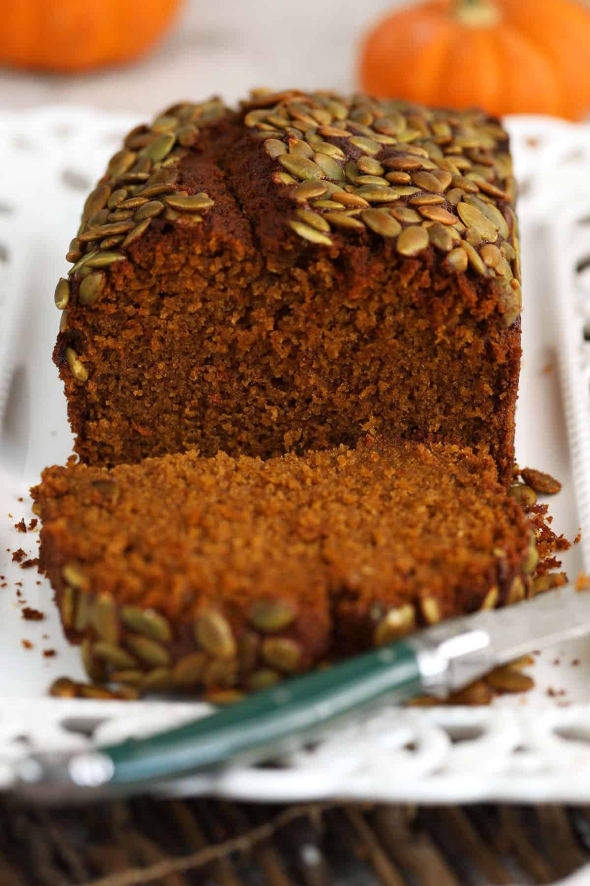 Sliced pumpkin loaf with knife