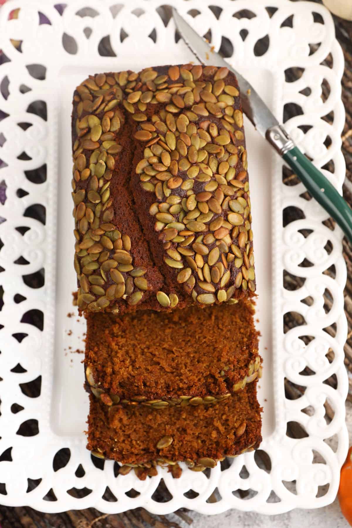 Overhead view of pumpkin loaf with two slices cut