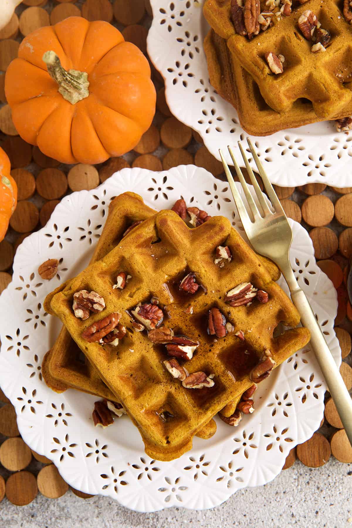 Overhead view of pumpkin waffles on plate