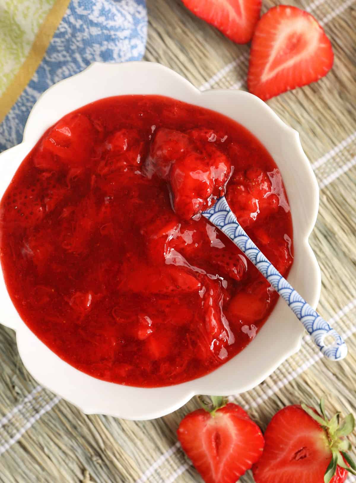 Strawberry compote in bowl with spoon