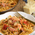 Cajun shrimp pasta on plate with fork