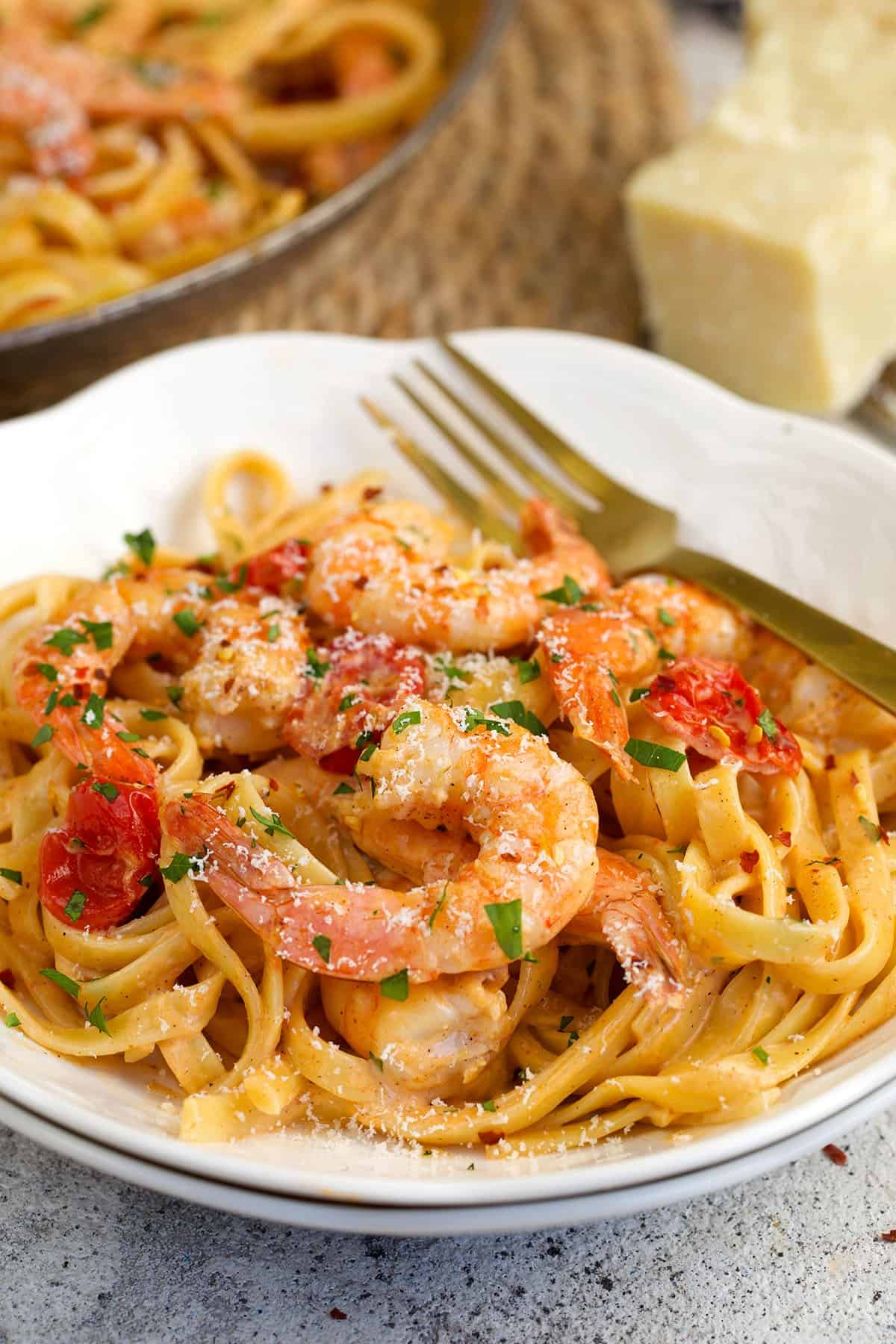 Cajun shrimp pasta on plate with fork