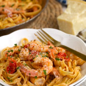 Cajun shrimp pasta on plate with fork