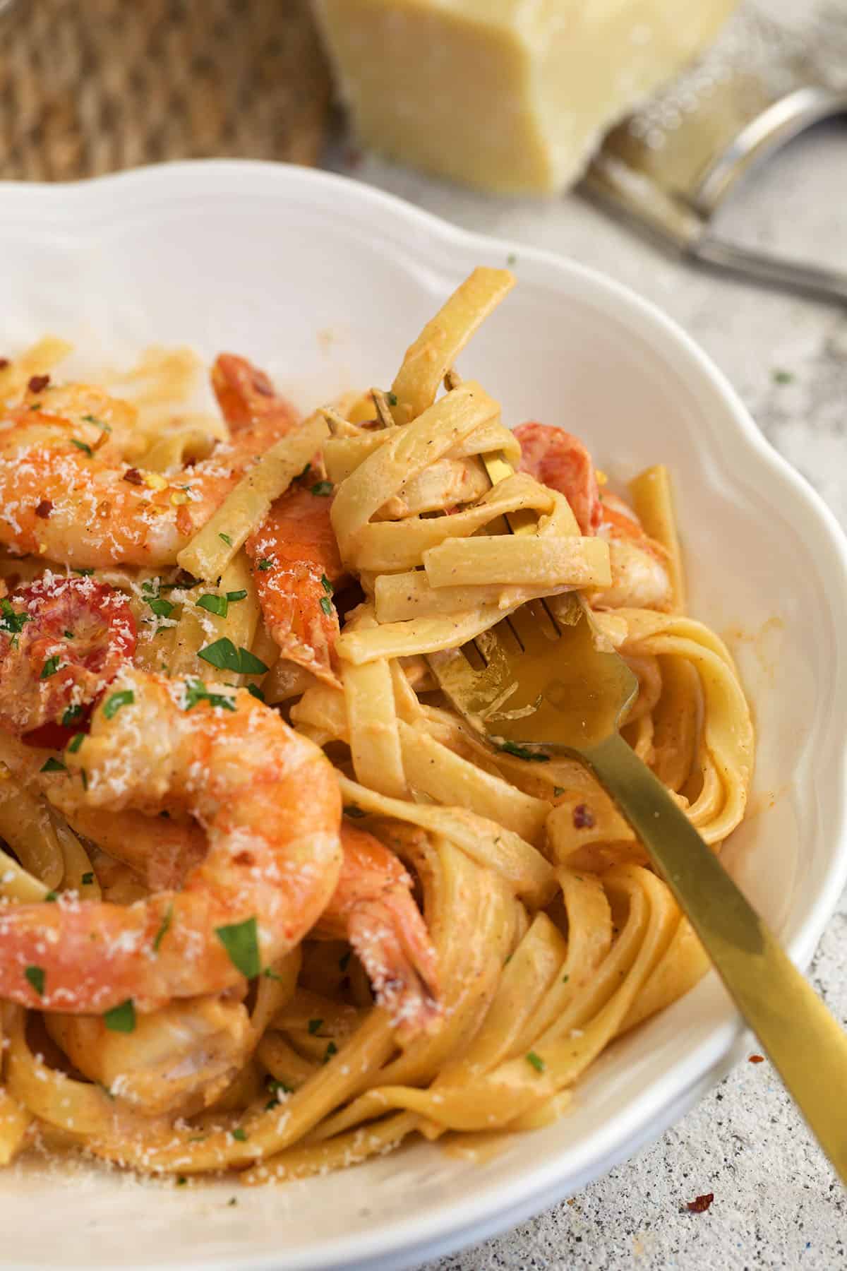 Closeup of Cajun shrimp pasta twirled on fork