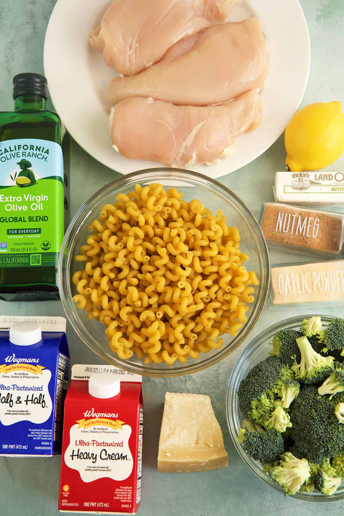 Overhead view of ingredients for chicken and broccoli pasta