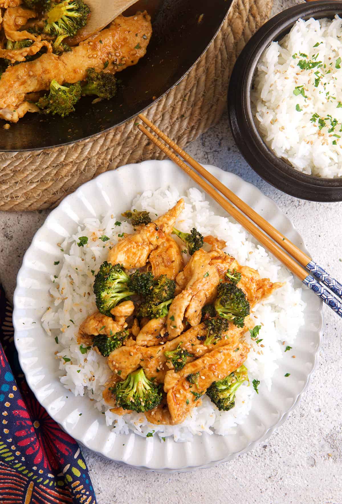 Chicken and broccoli stir fry on plate with rice