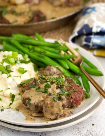 Chopped steak with gravy on plate