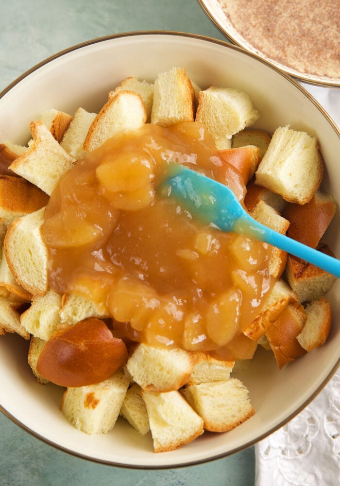 Stirring ingredients for cinnamon apple French toast casserole