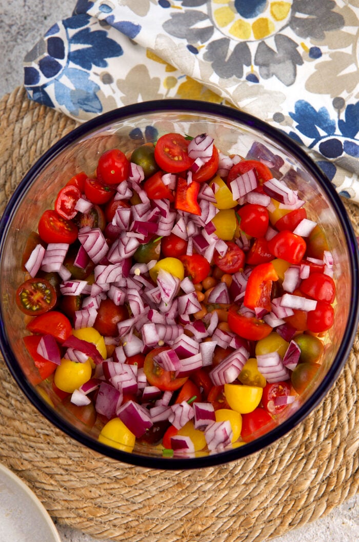 Overhead view of cornbread salad being assembled