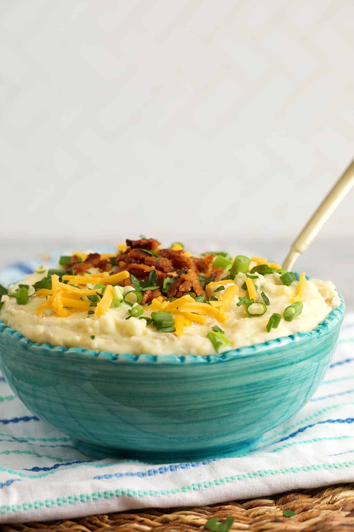 Loaded mashed potatoes with bacon and cheese in bowl