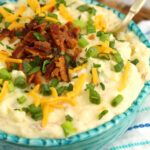 Bowl of loaded mashed potatoes with bacon and cheese