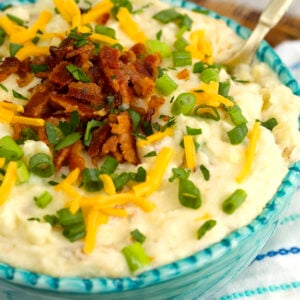 Bowl of loaded mashed potatoes with bacon and cheese