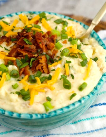 Bowl of loaded mashed potatoes with bacon and cheese