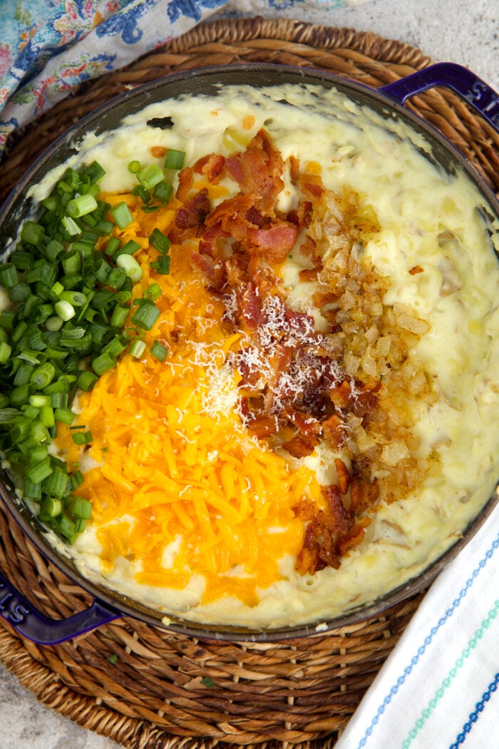 Cheese, bacon, and green onions added to mashed potatoes