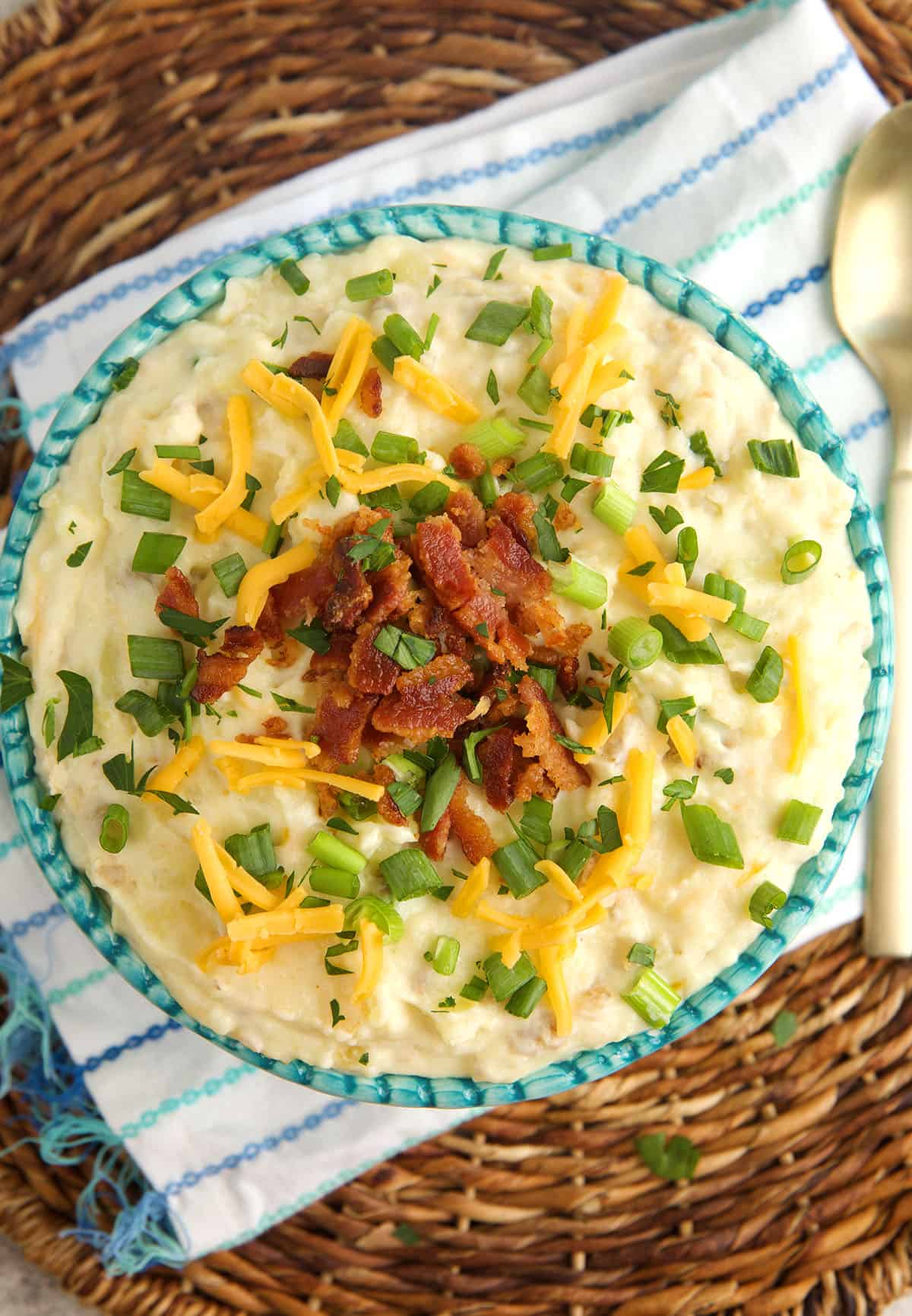 Overhead view of loaded mashed potatoes in serving bowl