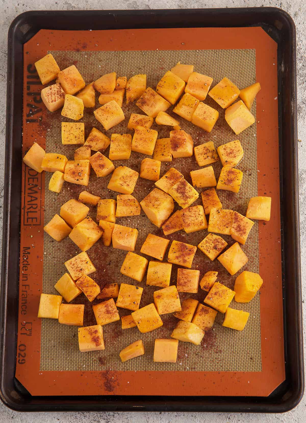 Overhead view of roasted butternut squash on pan