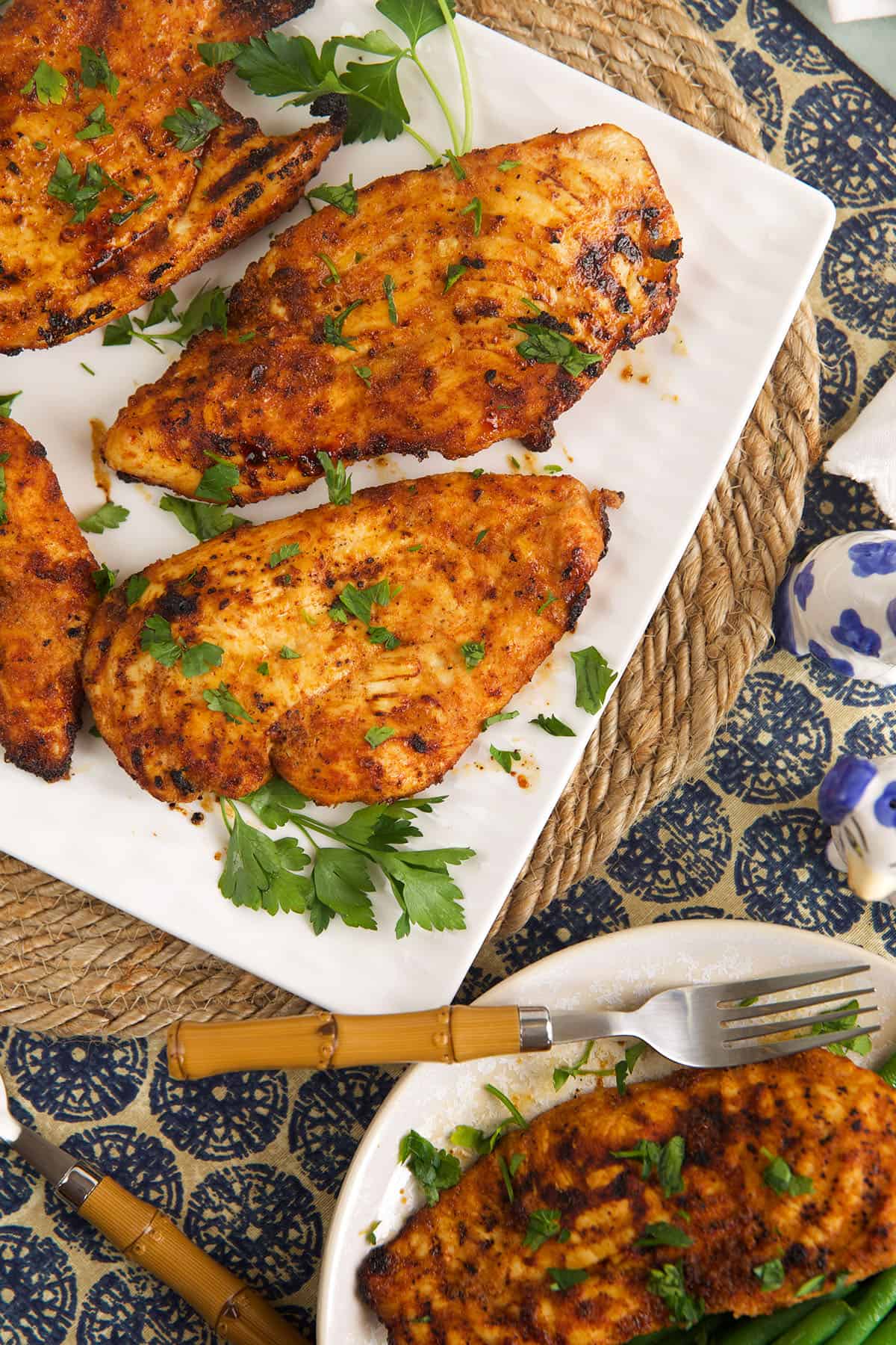 Overhead view of air fryer chicken breasts on plate