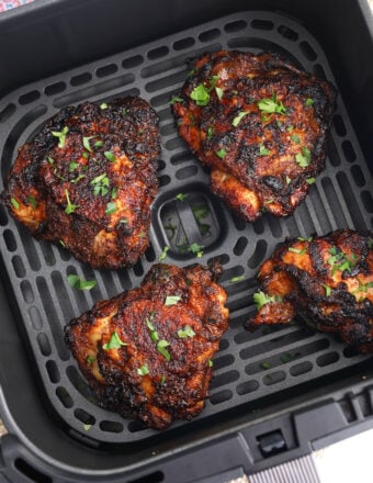 Air fryer chicken thighs in basket