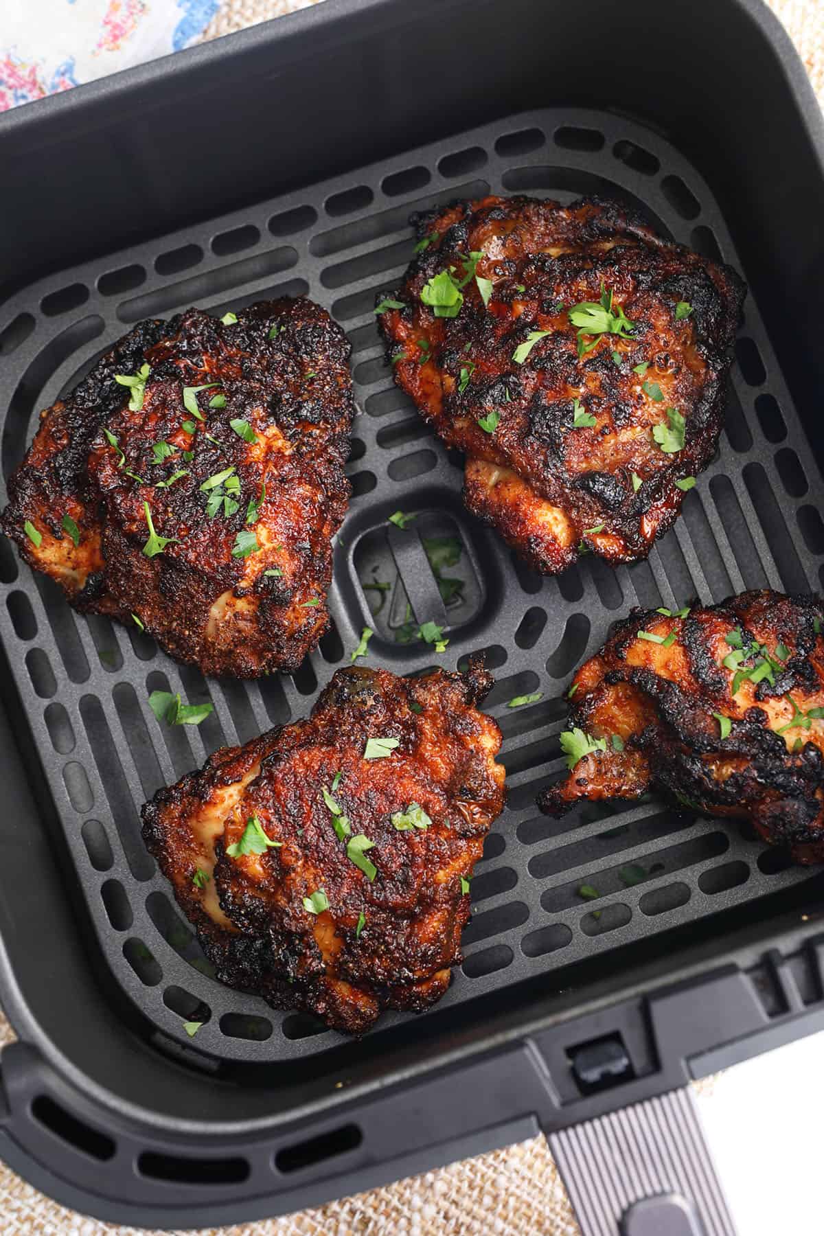 Air fryer chicken thighs in basket