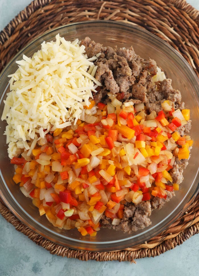 Overhead view of ingredients in bowl for Amish breakfast casserole