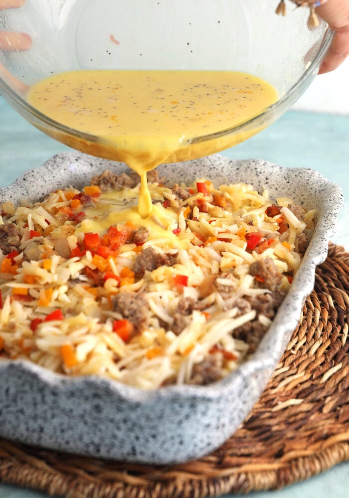 Pouring egg mixture into casserole dish