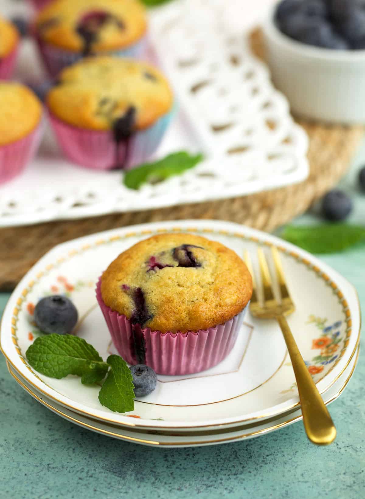 Moist banana blueberry muffin on plate