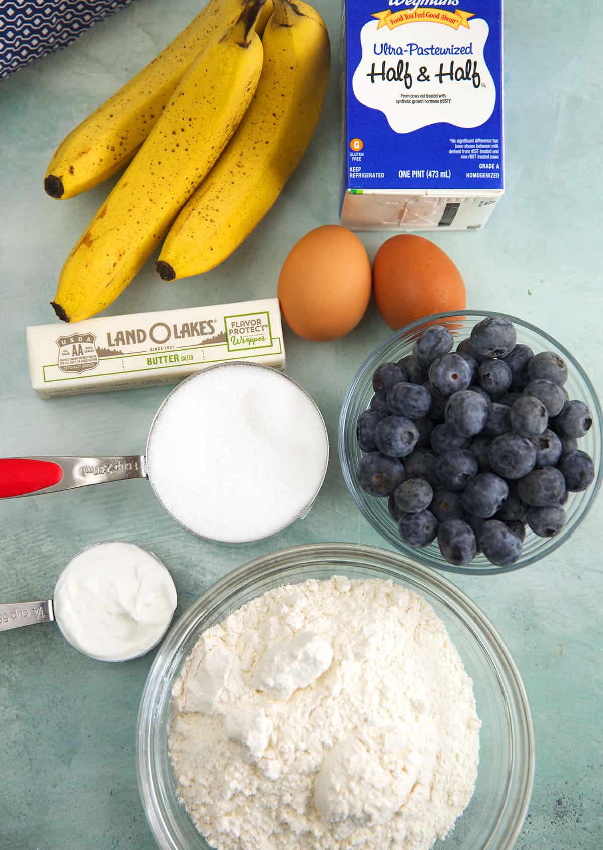 Overhead view of ingredients for banana blueberry muffins