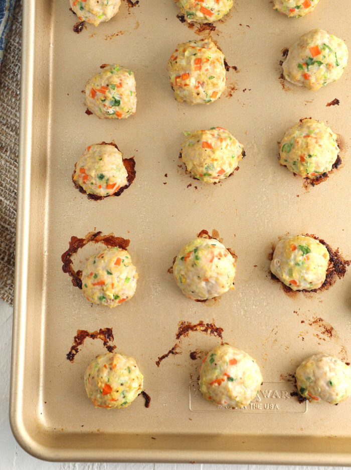 Buffalo chicken meatballs on baking sheet