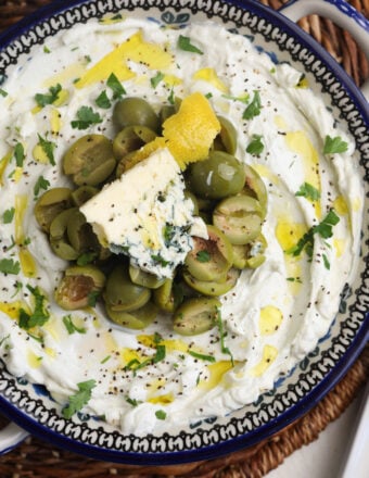 Overhead view of dirty martini dip in bowl