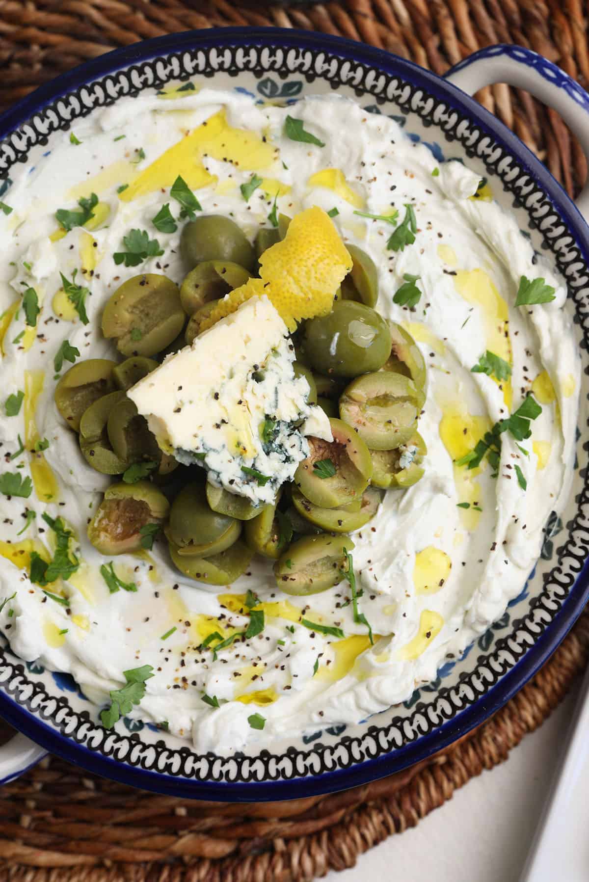 Overhead view of dirty martini dip in bowl