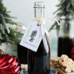 Bottle of homemade gingerbread syrup with tag