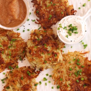 Overhead view of crispy Polish potato pancakes on platter