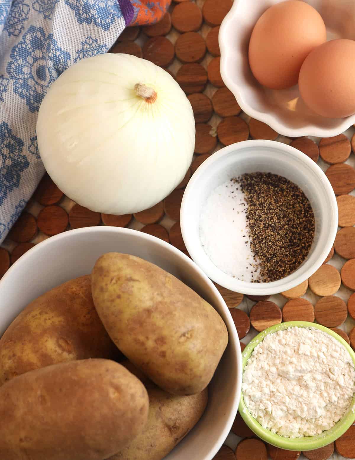 Overhead view of ingredients for Polish potato pancakes