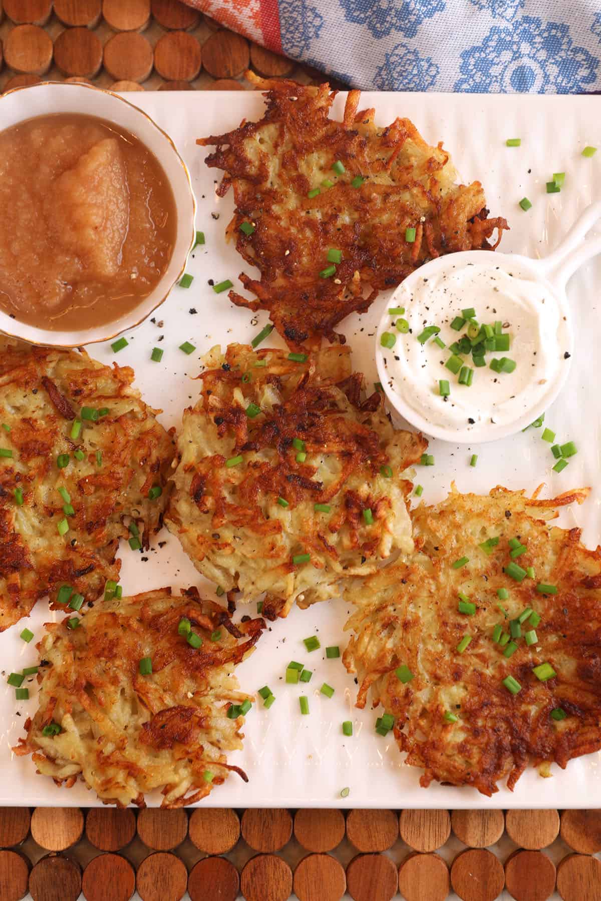 Overhead view of crispy Polish potato pancakes on platter