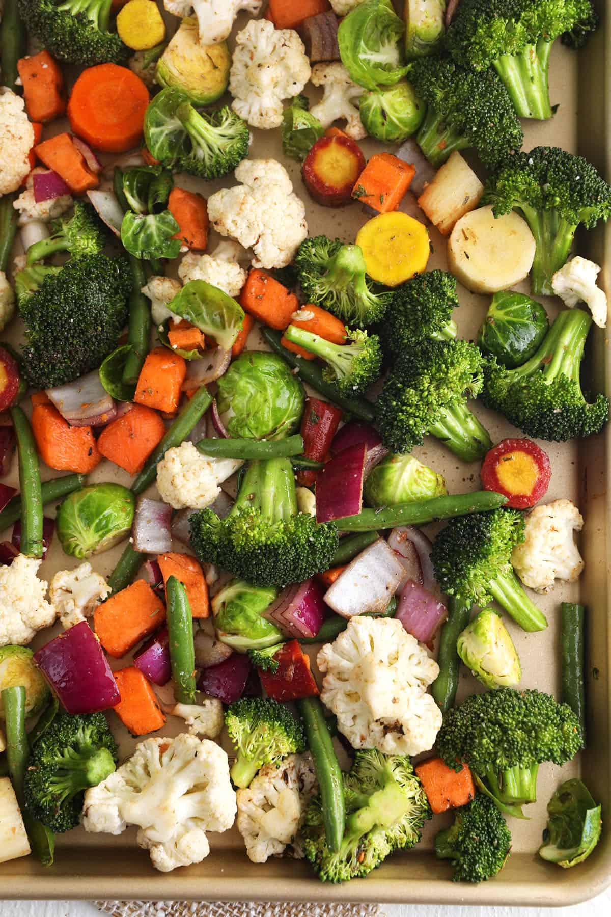 Overhead view of vegetables on baking sheet