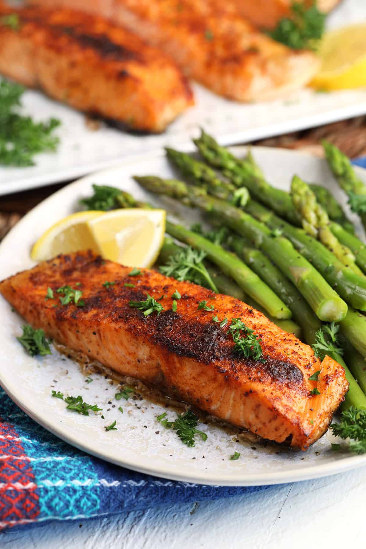 Crispy air fryer salmon on plate with asparagus