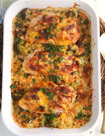 Overhead view of cheesy chicken and rice casserole in baking dish