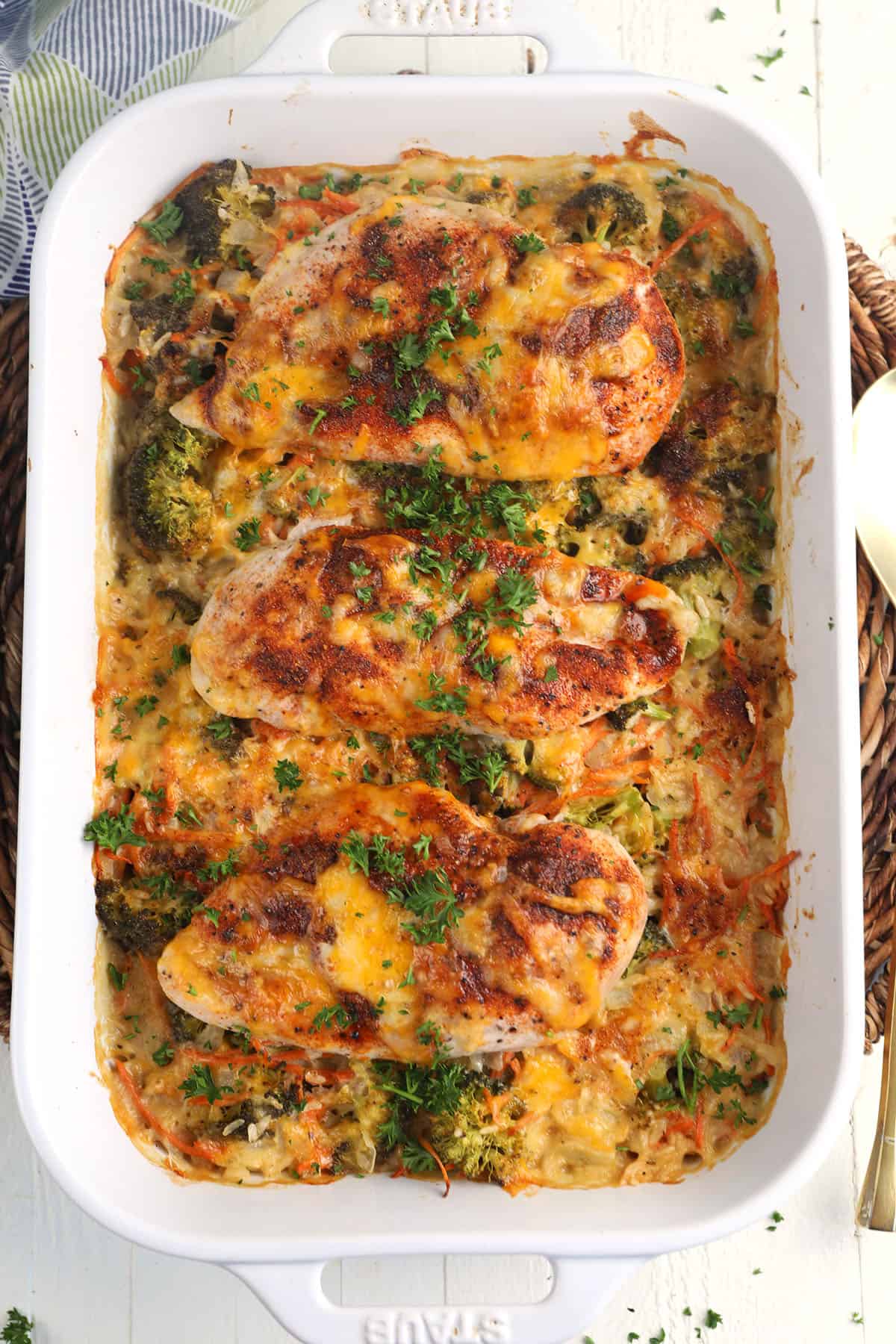 Overhead view of cheesy chicken and rice casserole in baking dish