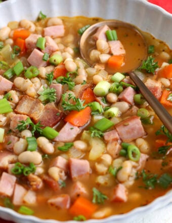 Navy bean soup with ham in bowl