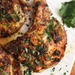 Overhead view of air fryer pork chops on plate
