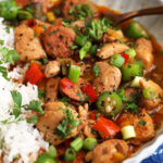 Chicken and sausage gumbo in bowl with rice